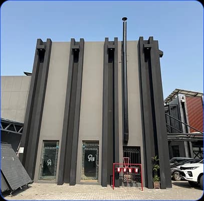 Modern industrial building exterior with vertical architectural fins
