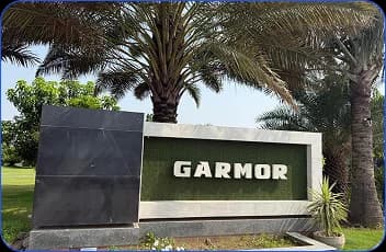GARMOR corporate entrance sign with palm trees