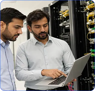 IT professionals reviewing systems in a server room